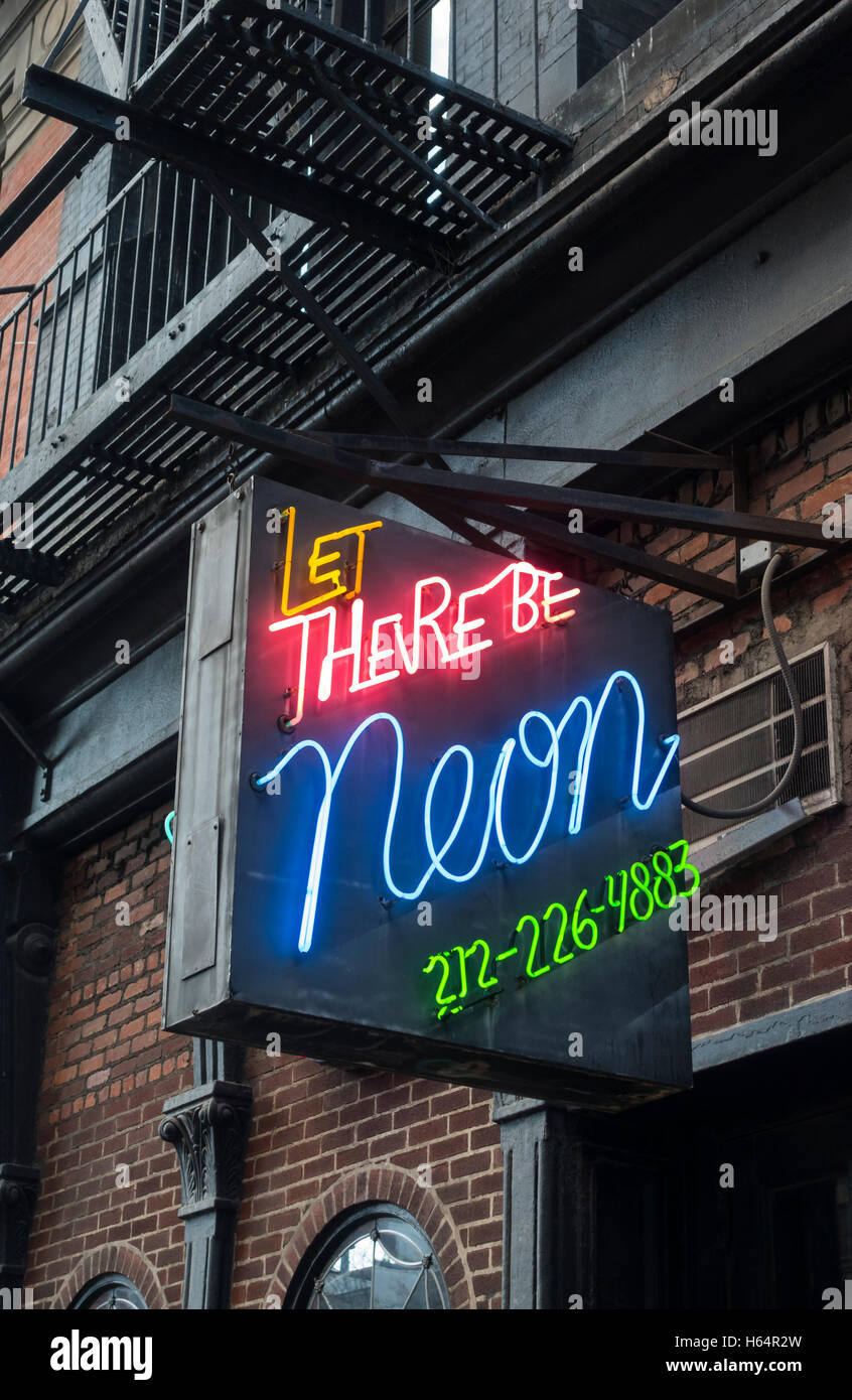 Let There Be Neon sign outside a retailer in Tribeca in New York City