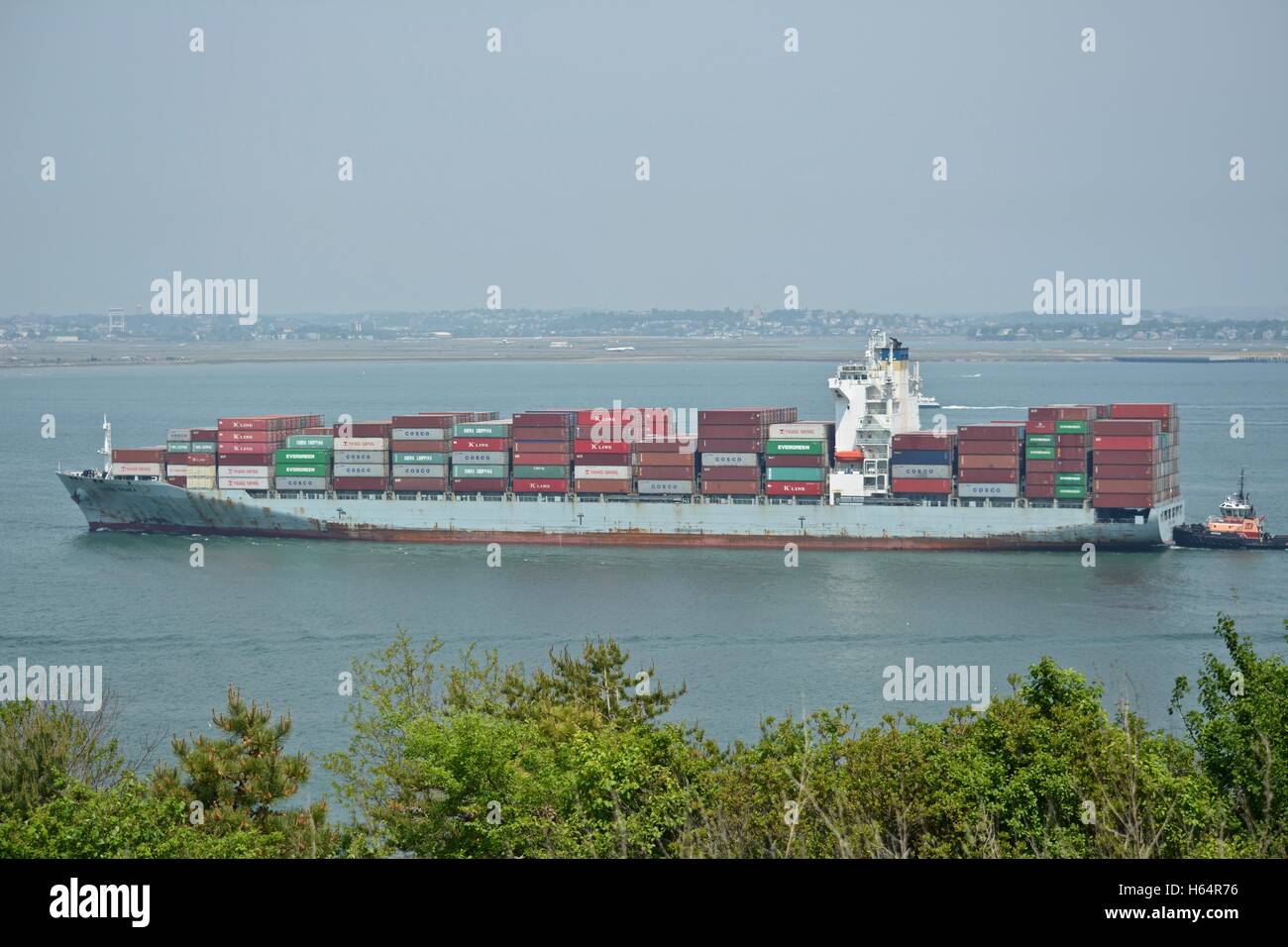 A cargo ship sailing into the Boston Seaport Cargo Terminal in South Boston, Massachusetts Stock