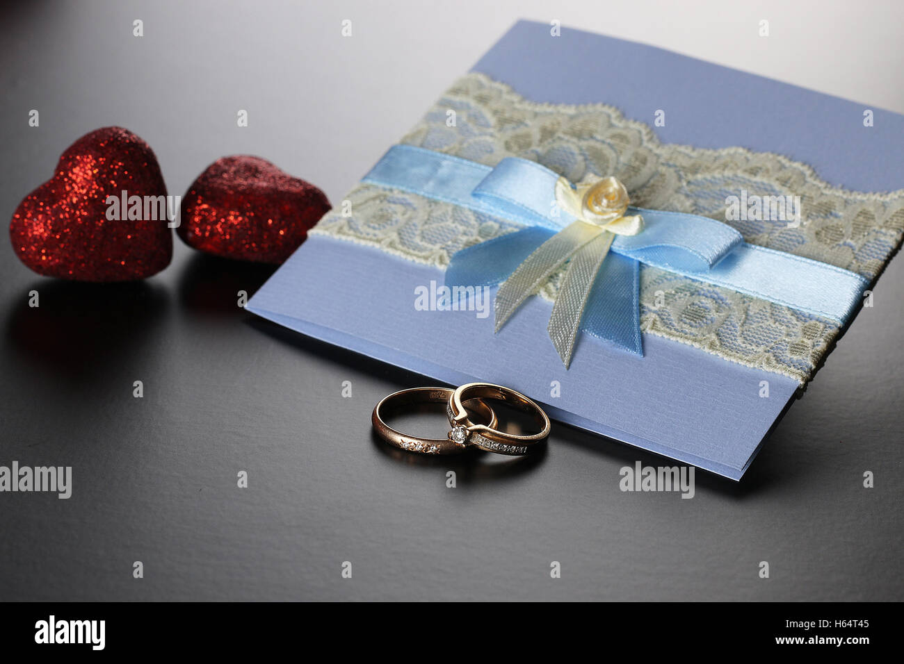 Wedding rings ribbon Stock Photo - Alamy