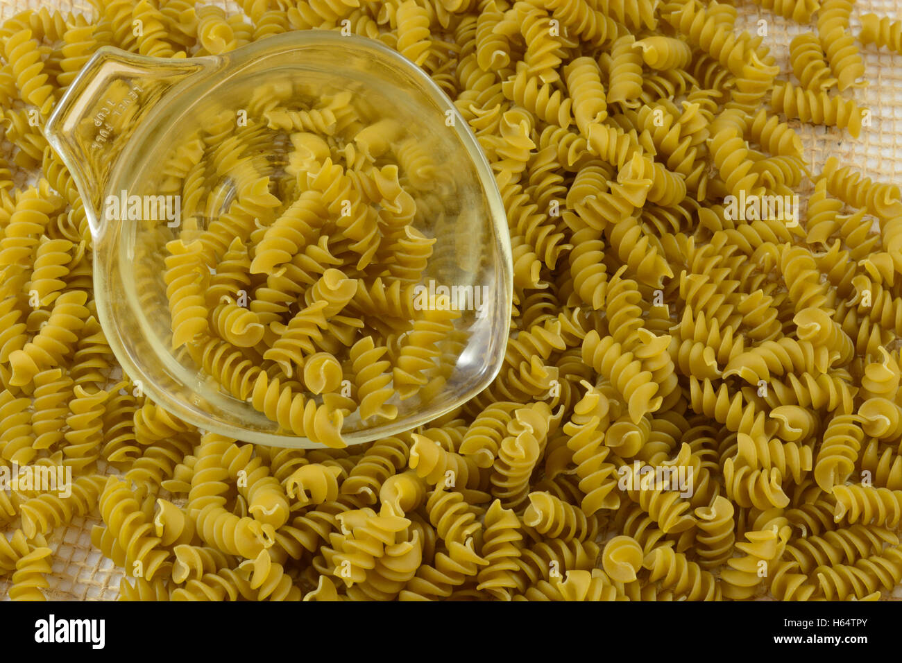 Vegetable Rotini Pasta made from zucchini and spinach puree with glass