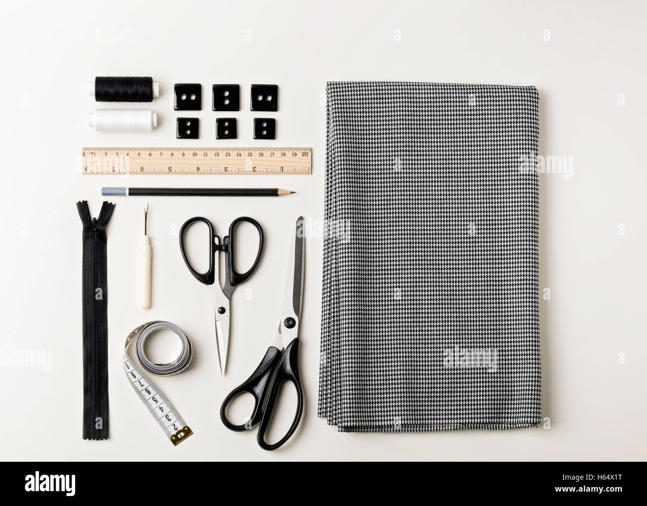 Everything for sewing in black and white. Fabric and thread, zipper and ...