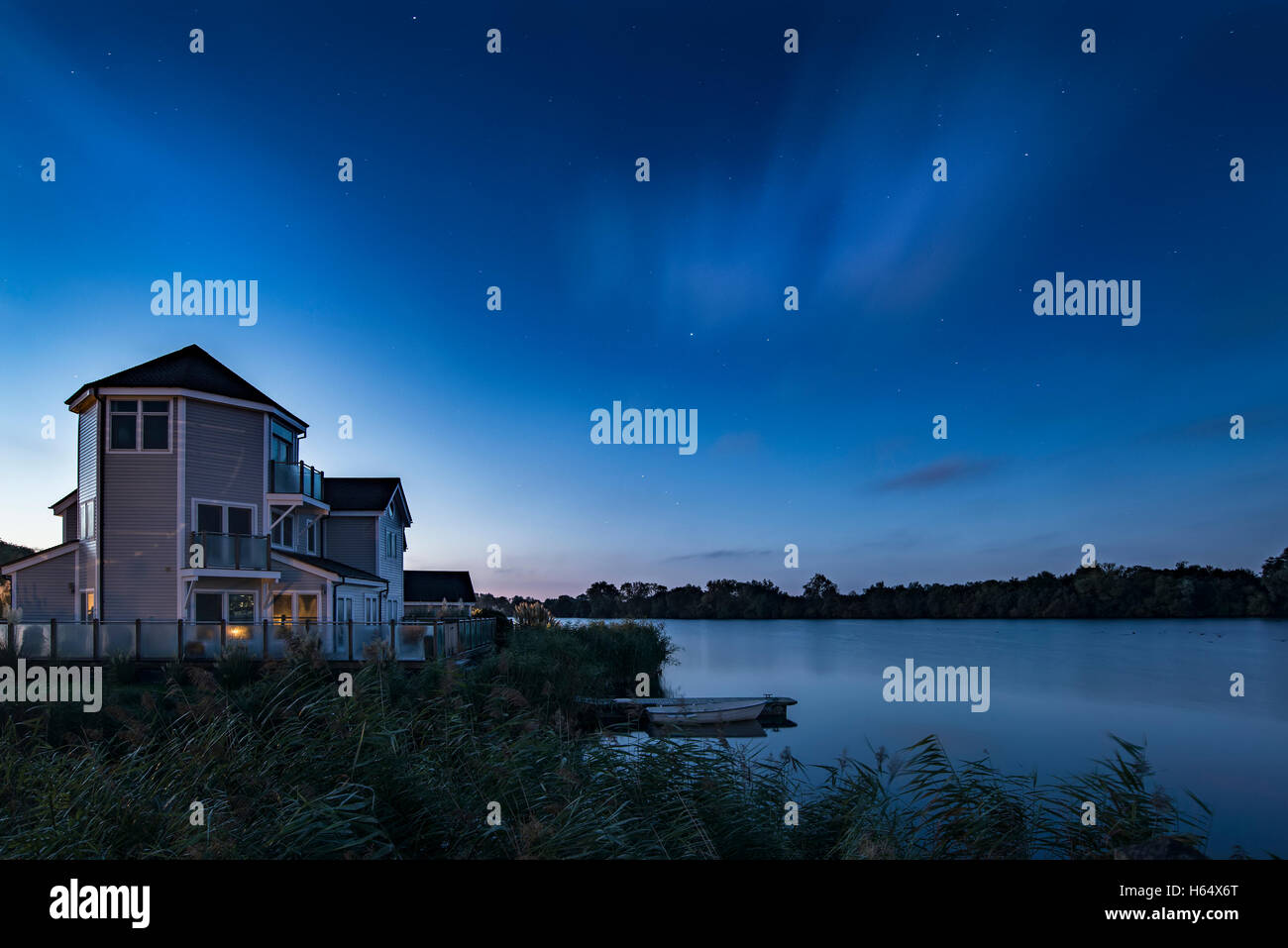 Beautiful night sky astrophotography landscape image of stars over still lake Stock Photo