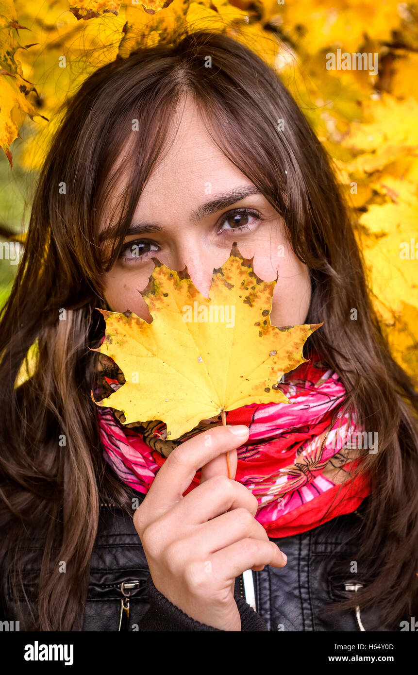Girl in autumn landscape, with yellow leaves background in Prague ...