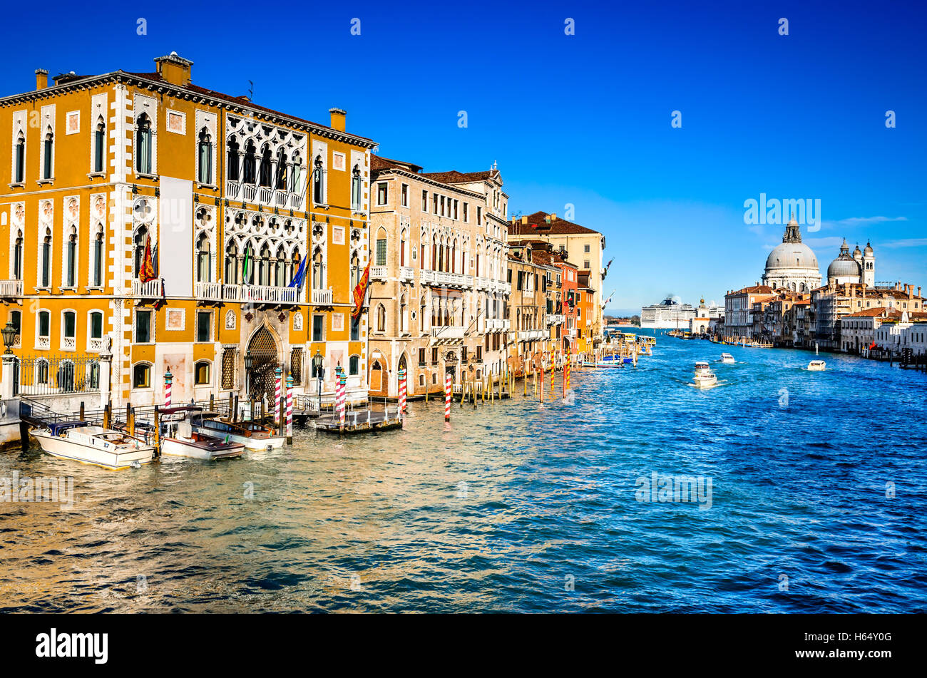 Venice, Italy. Gorgeous view of the Grand Canal and Basilica Santa Maria della Salute during sunset with interesting clouds. Stock Photo