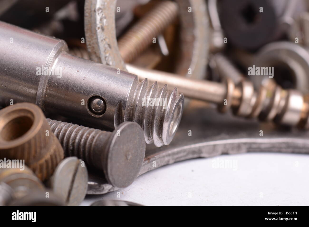 Big stack of metal threaded screwbolts nuts and bolt washers on