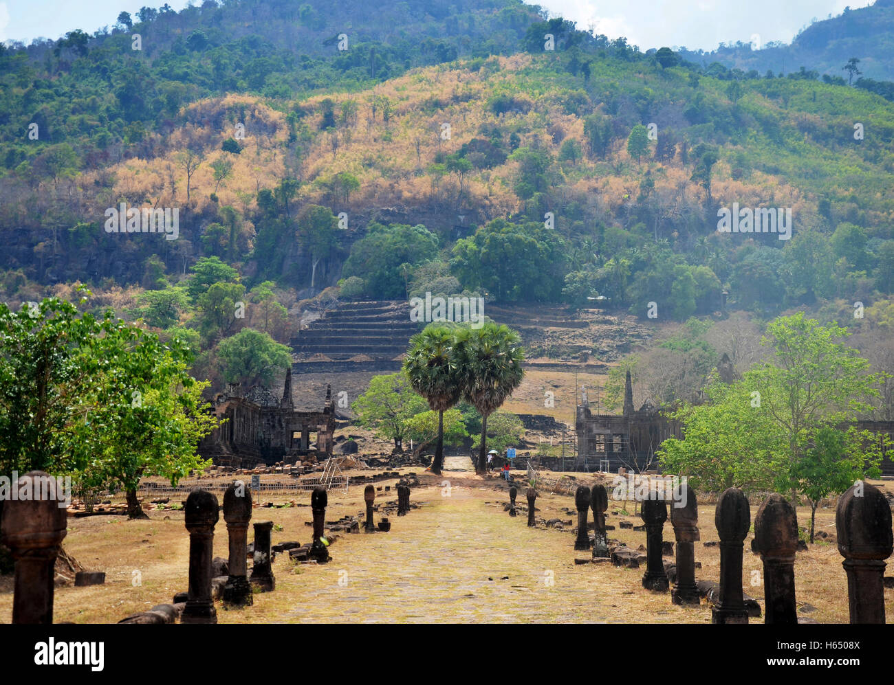 View landscape with walkway of archaeological site Wat Phu or Vat Phou 10th century is a ruined Khmer Hindu temple in Champasak Stock Photo