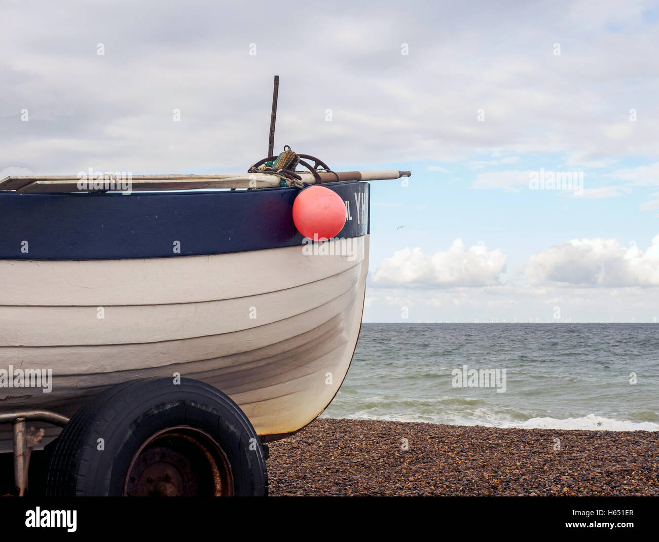 Traditional Norfolk crab boat hauled out on the shingle beach at Weybourne, Norfolk. Stock Photo