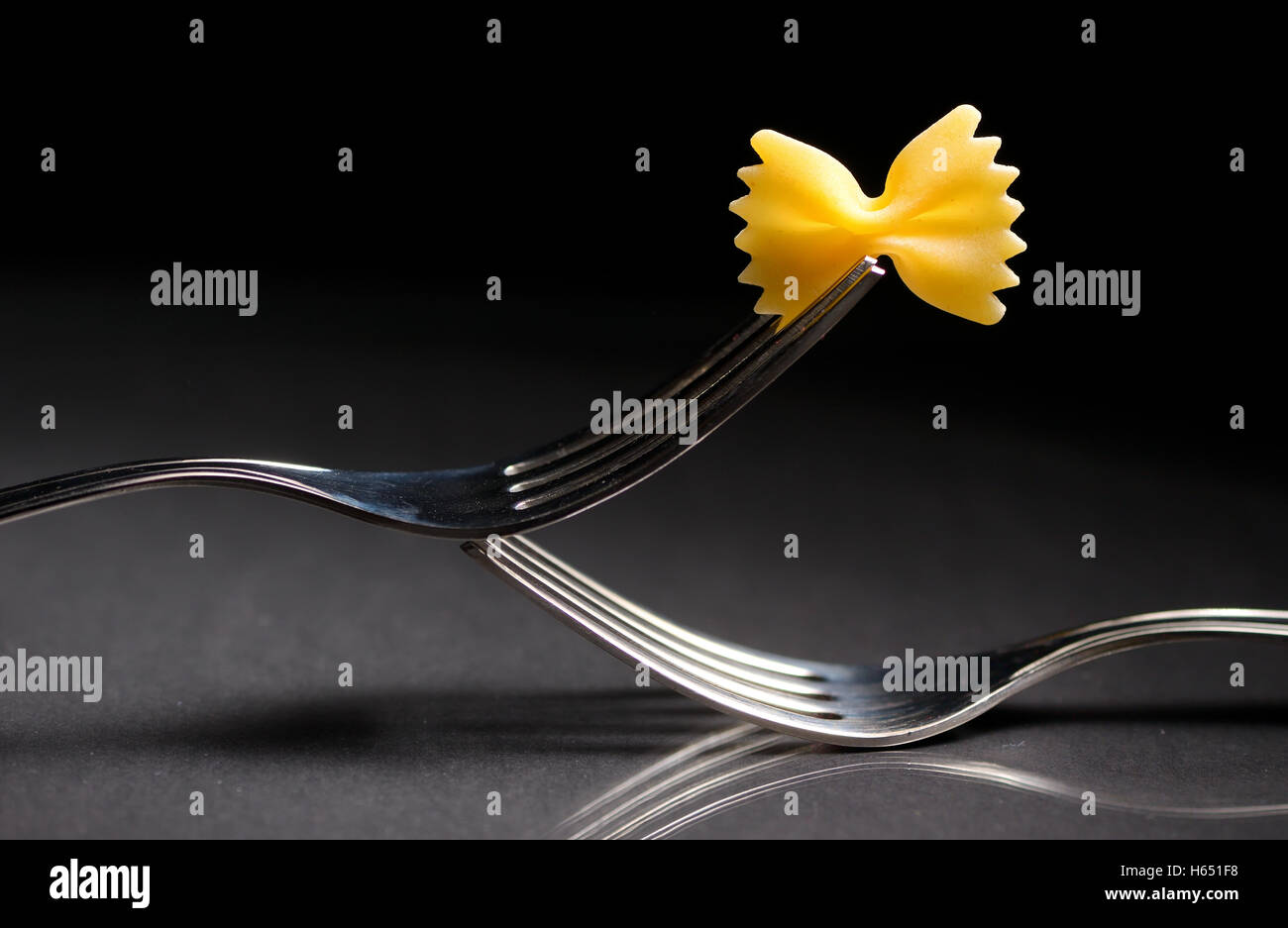 Reflexion of pasta farfalle on a fork Stock Photo