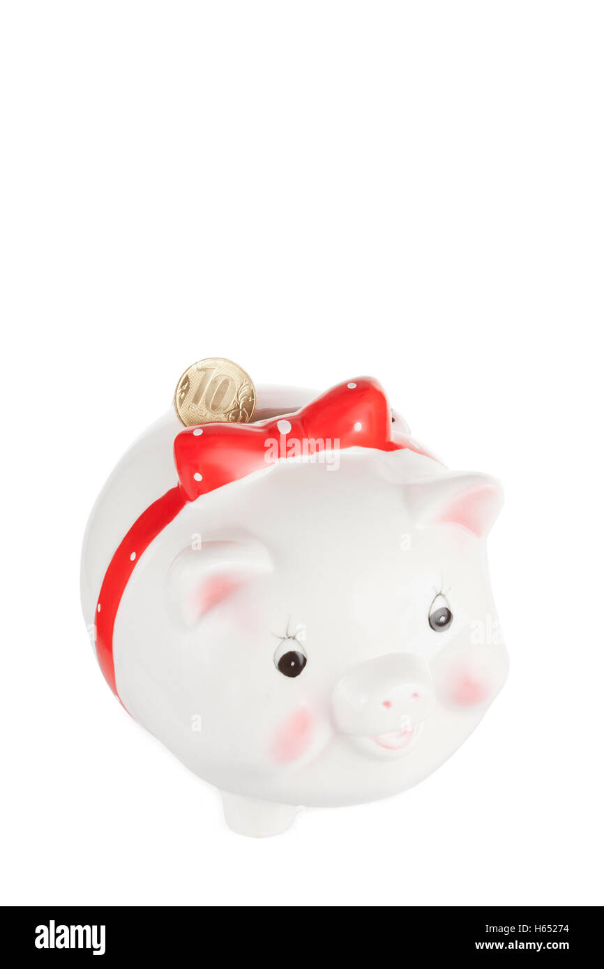 White pig moneybox with a coin isolated on a white background Stock Photo