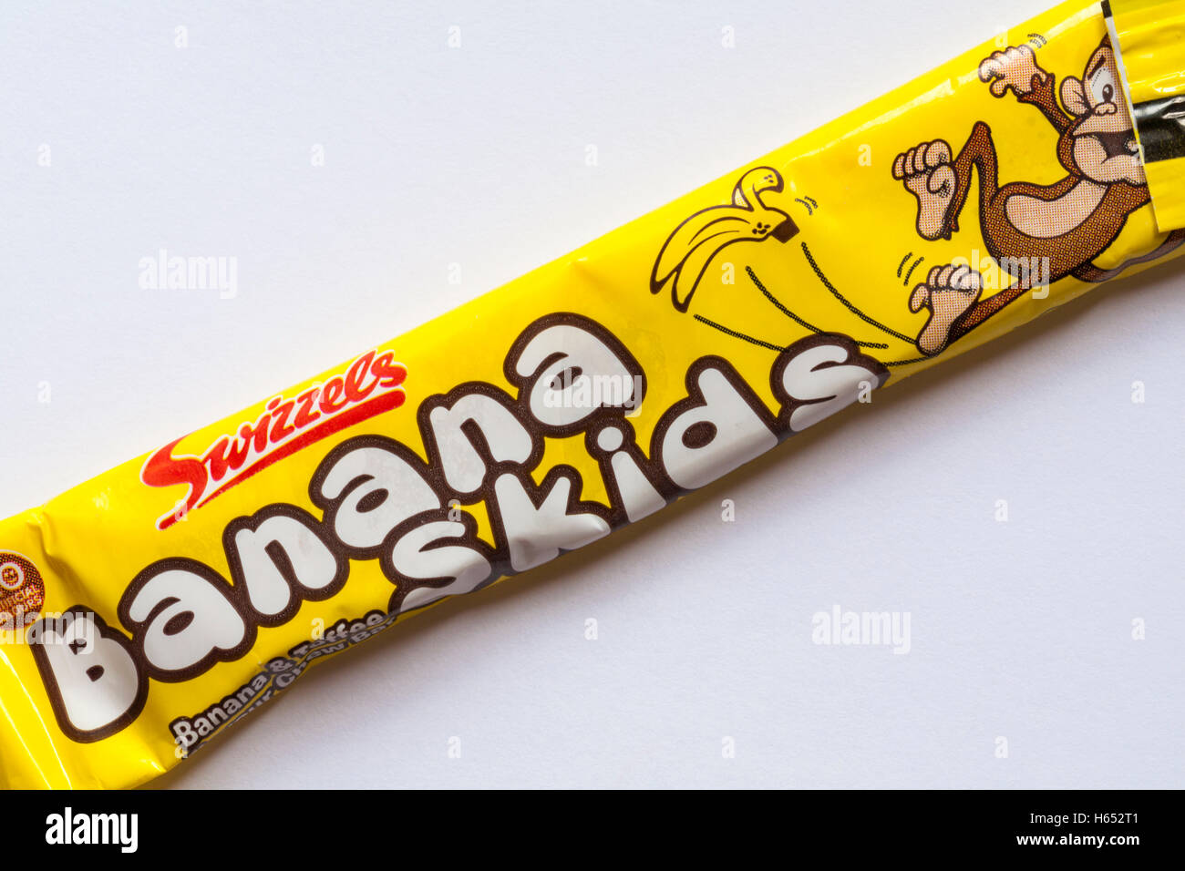 Swizzels banana skids banana & toffee flavour chew bar set on white background Stock Photo