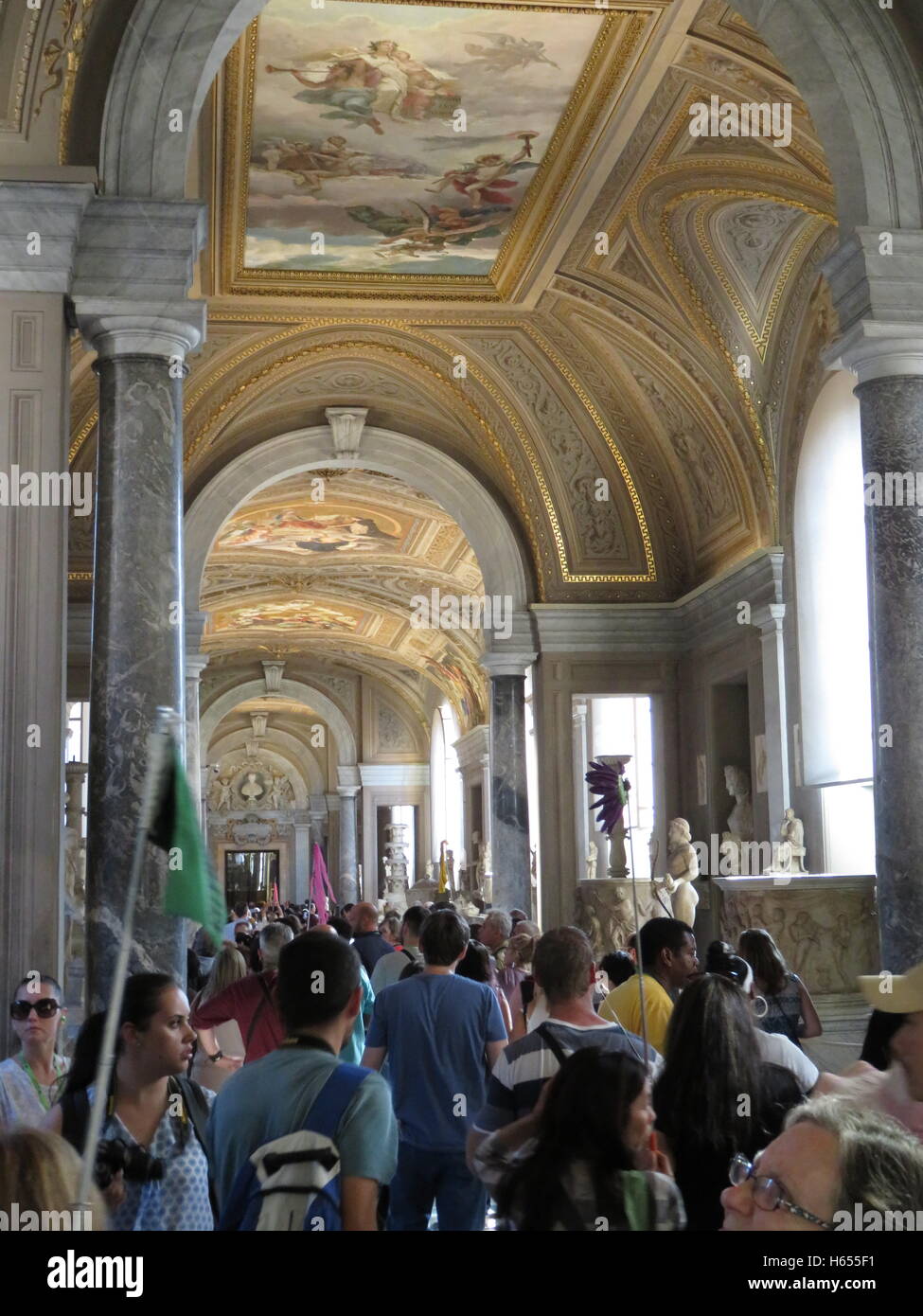 Tourists walking through the Vatican Museum Stock Photo