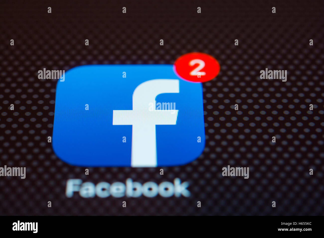 Facebook social network app close up on iPhone smart phone screen Stock Photo