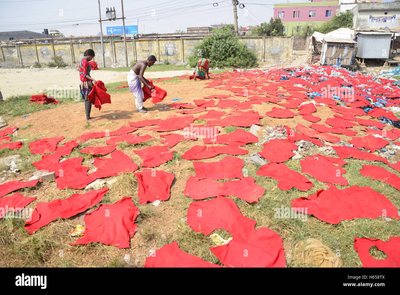 Bangladeshi laborer dries out unprocessed leather for a local shoe
