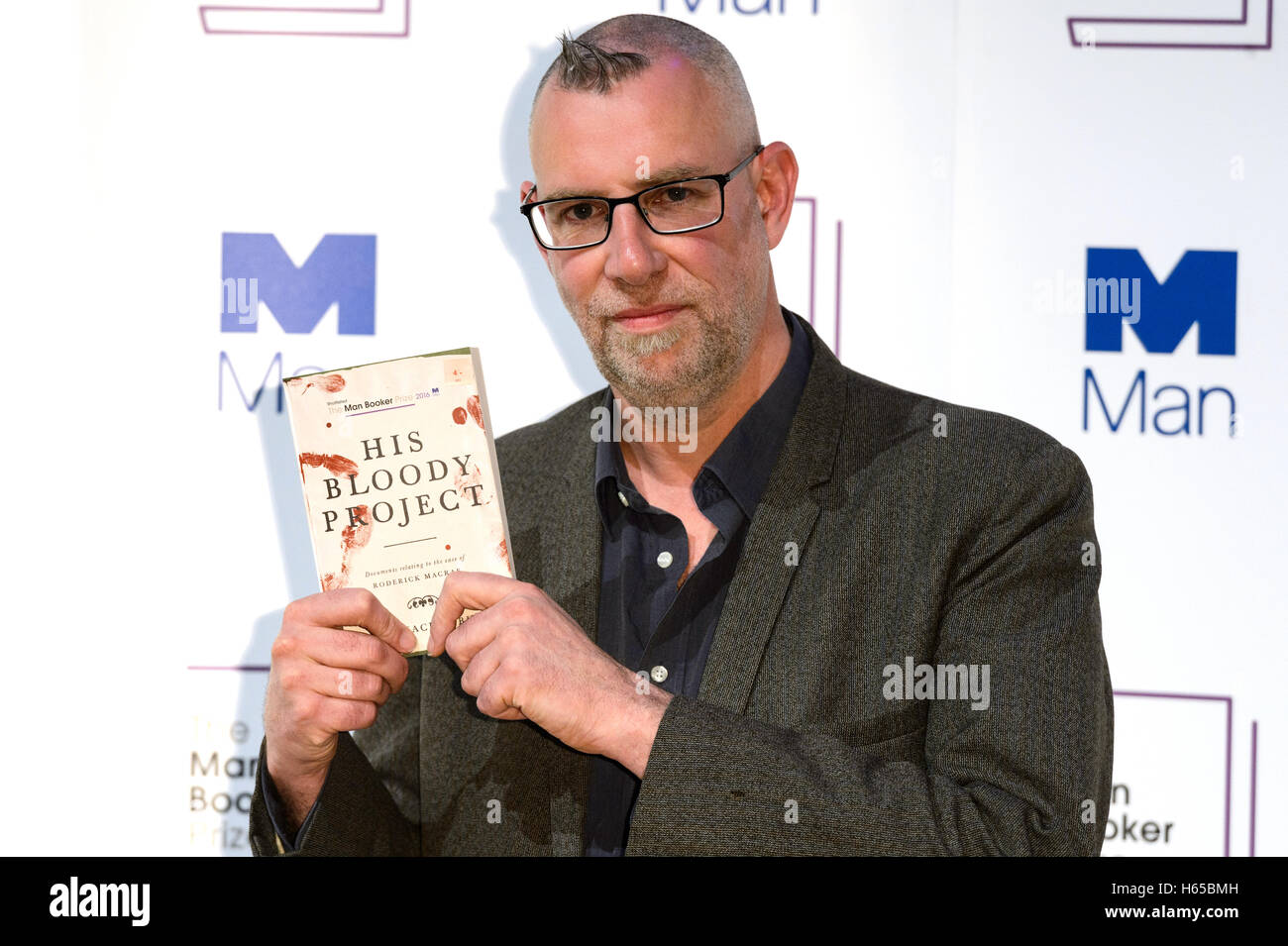 London, UK. 24th Oct, 2016. Author Graeme Macrae Burnet with his book 'His Bloody Project' attends the Man Booker Prize for Fiction photocall. London, UK. Credit:  Raymond Tang/Alamy Live News Stock Photo