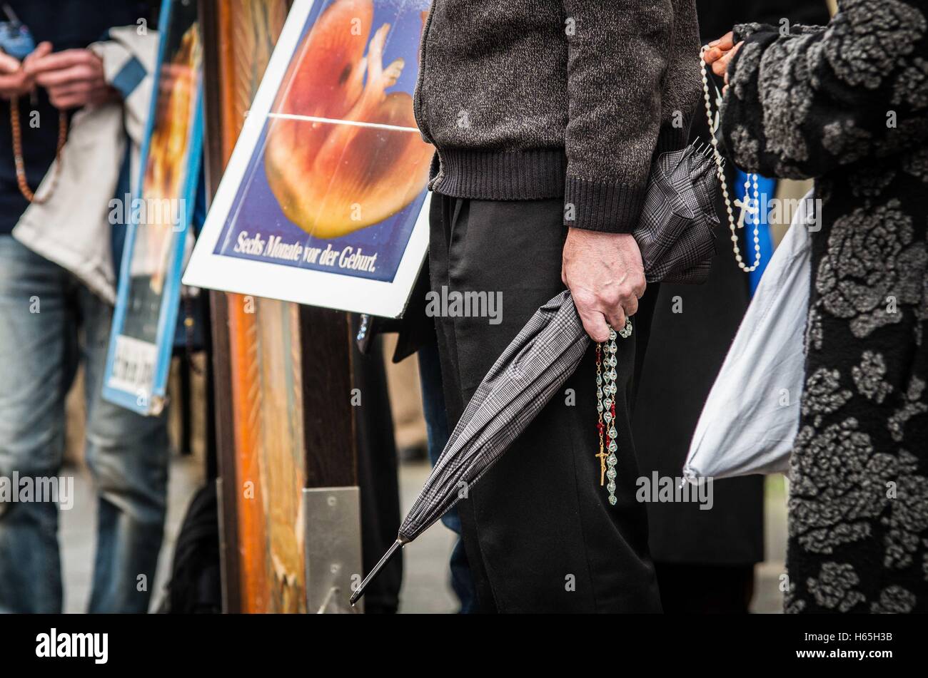 October 25, 2016 - October 25, 2016, Munich, Germany An anti-abortion group led by Wolfgang Hering (Helfer fuer Gottes Kostbare Kinder Deutschland e.V.) held a march through Munich near the Ludwig-Maximillians University, then stopped to demonstrate in front of the Pro-Familia family planning offices on Tuerkenstrasse. The protesters held up banners, prayed, and sang hymns in front of the offices. Eleven demonstrators were with the group, appoximately 12 student counter-demonstrators accompanied peacefully. © Sachelle Babbar/ZUMA Wire/Alamy Live News Stock Photo