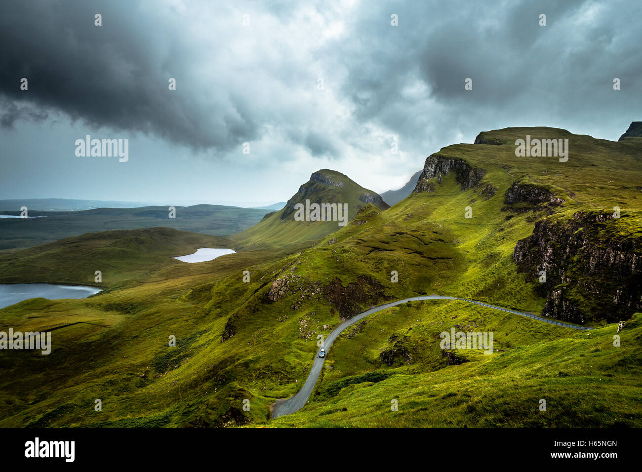 Car Driving In The Scottish Highland Mountain Landscapes Of The Quiraing, Isle of Skye, Scotland