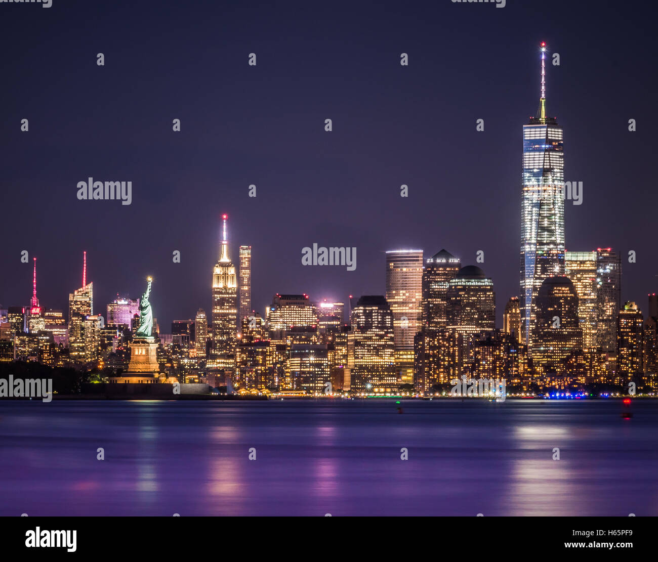 One World Trade Center, The Empire State and the Statue of Liberty captured together at night. Long Exposure photography Stock Photo