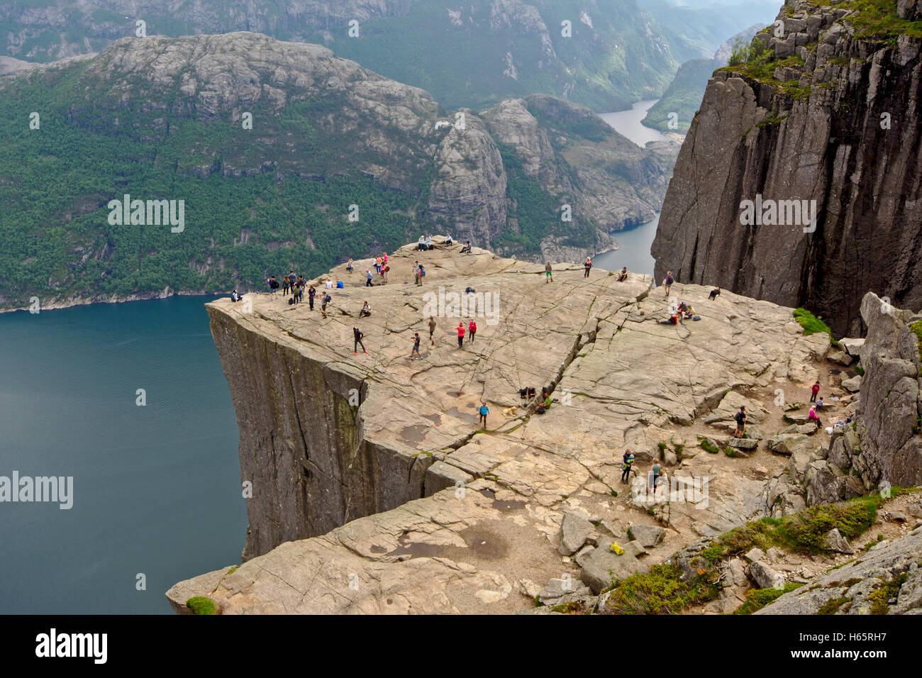 People watching the landscape from the famous Pulpit or Preikestolen ...