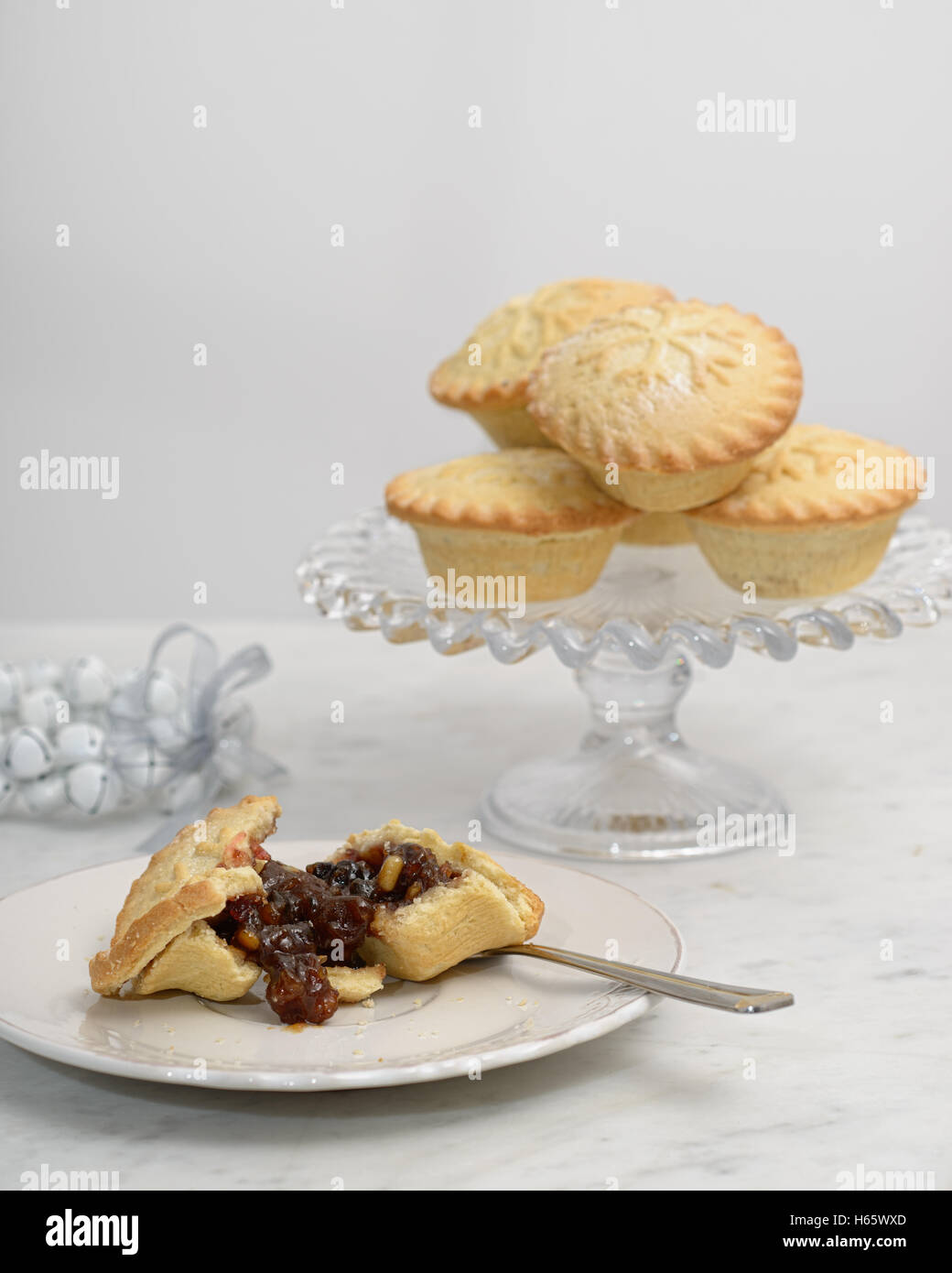 Cut mince pie with pastry fork Stock Photo Alamy