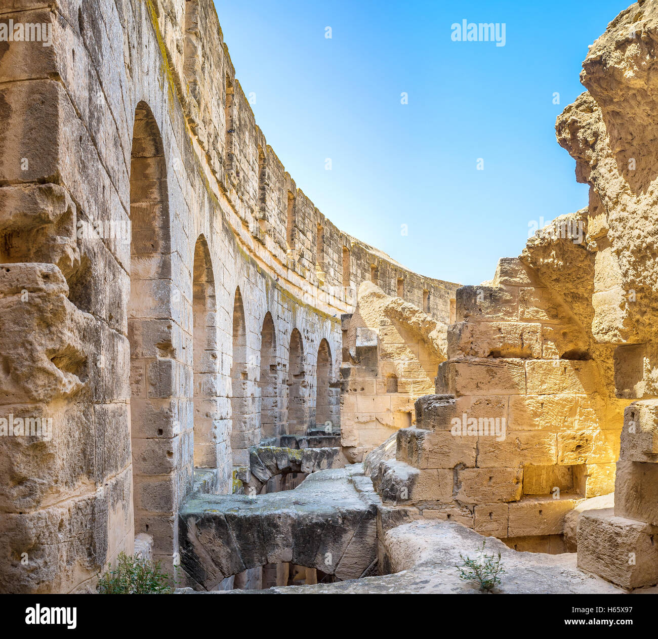 Some of constructions in the old Roman amphitheatre were ruined, but the main wall is in good condition, El Jem Tunisia Stock Photo