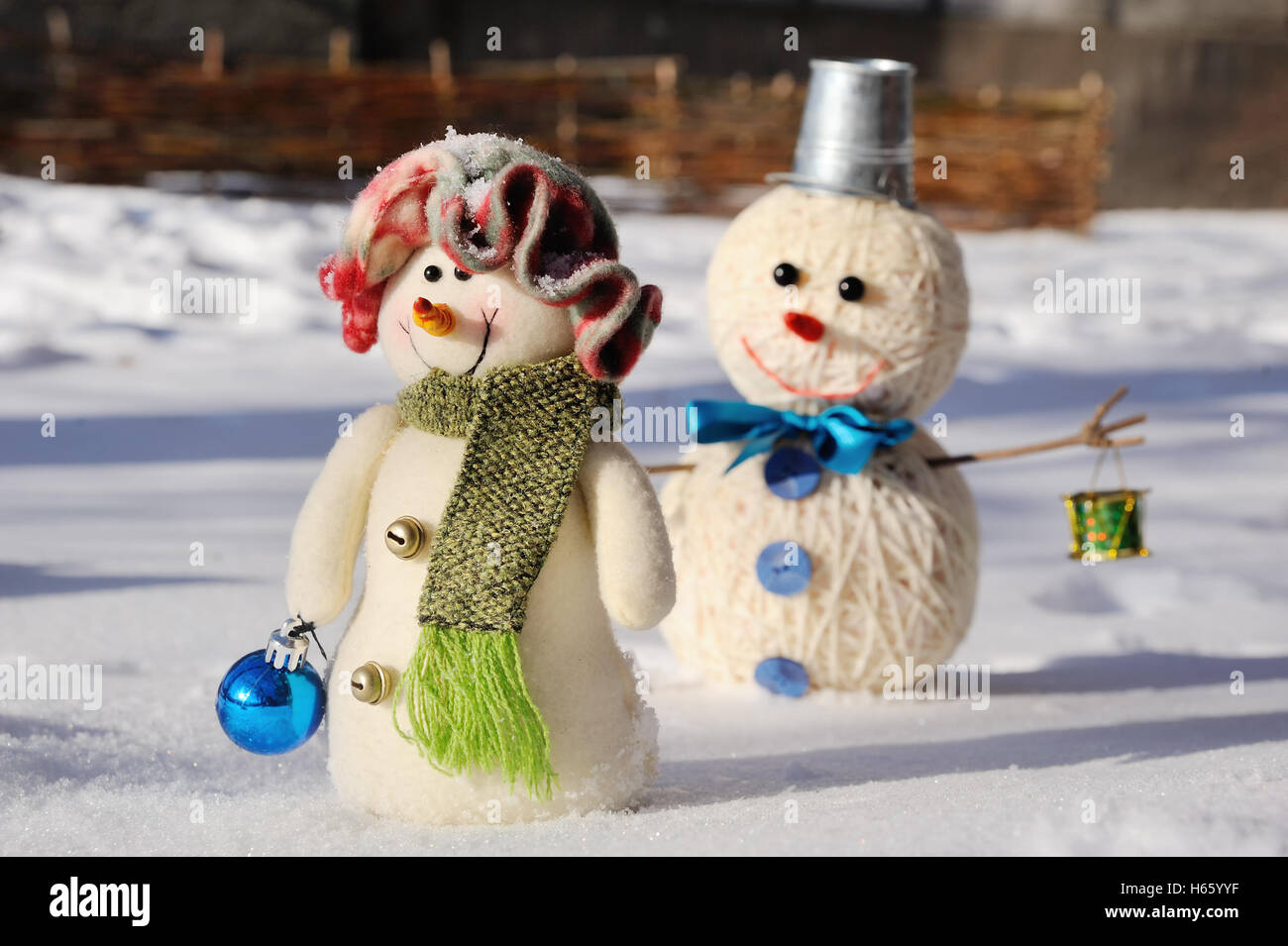 Two funny snowman in snow Stock Photo