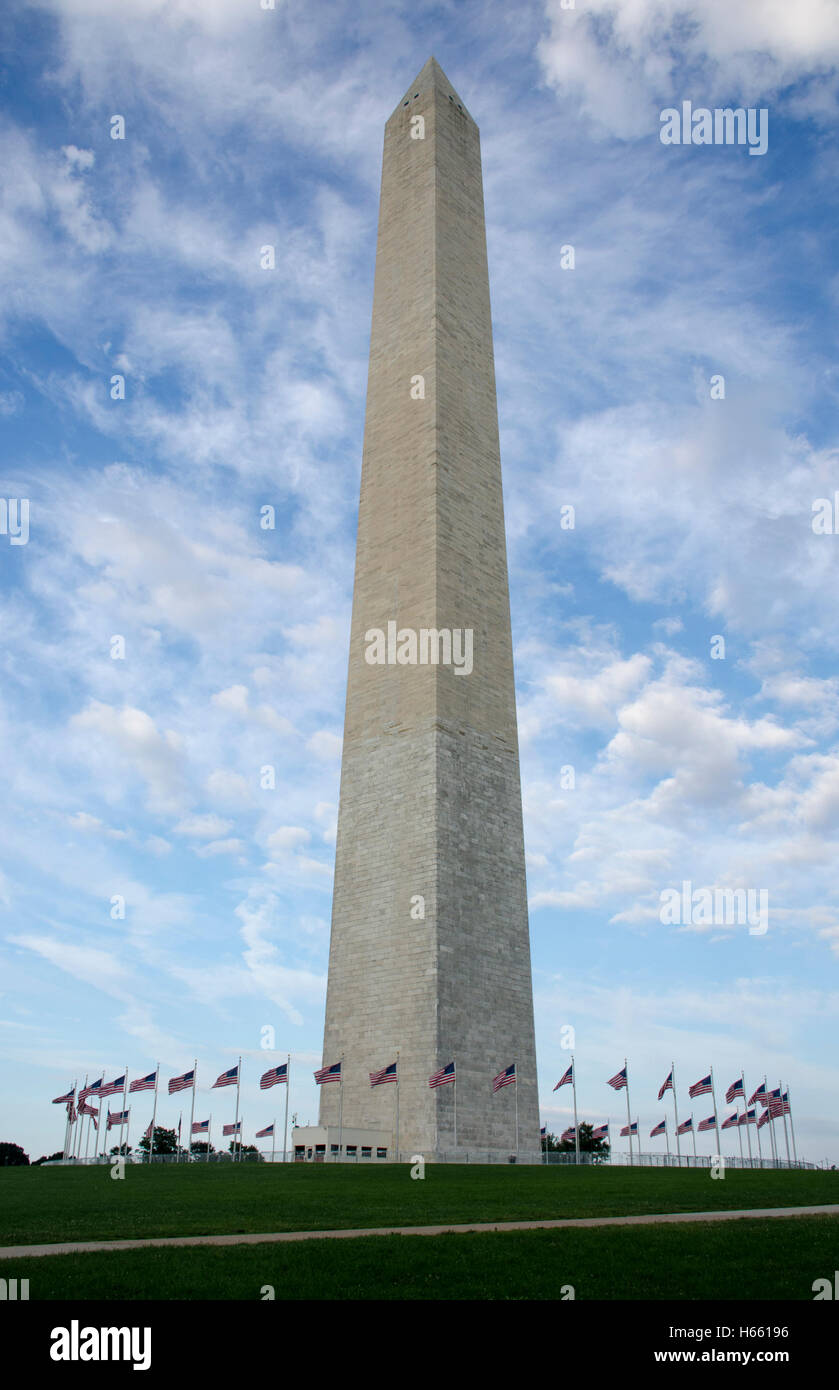 50 U.S. flags blow in the wind as they circle the Washington Monument on a brisk summer day. Stock Photo