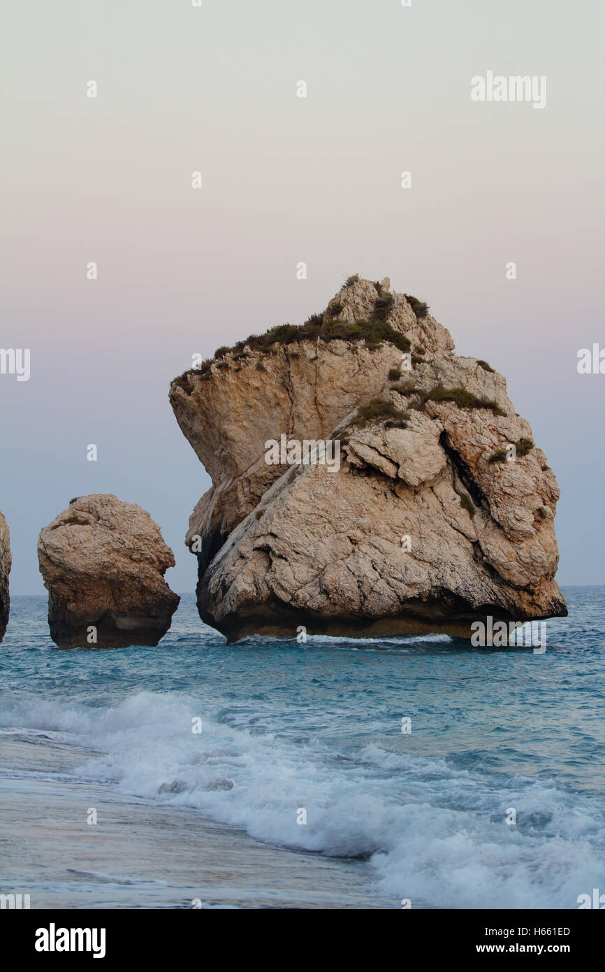 Rock formations on the beach at the ‘blue hour’, Petra Tou Romiou, Aphrodite's Birthplace, Cyprus Stock Photo