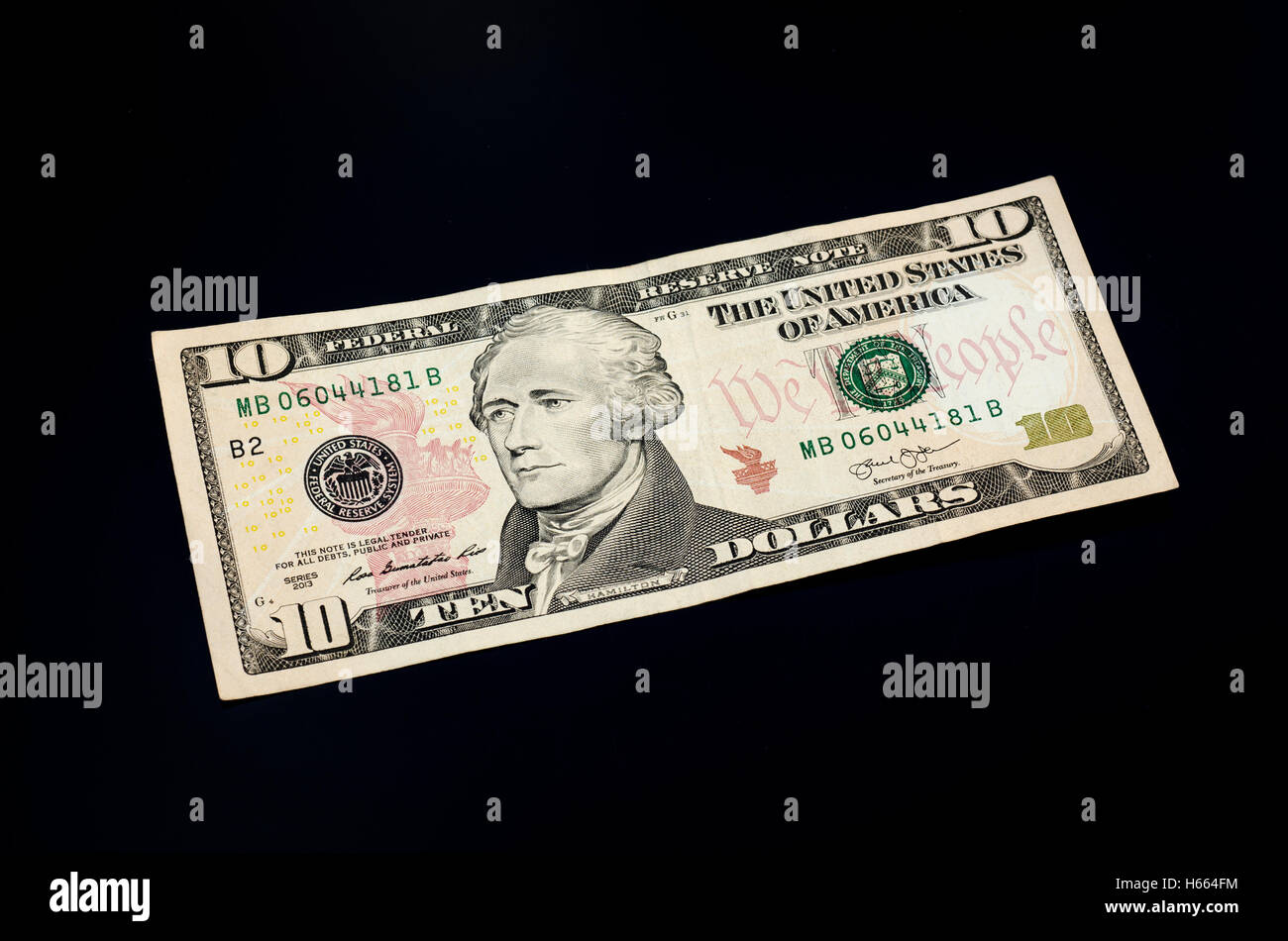 10 Dollar Bill on a Black Background Stock Photo
