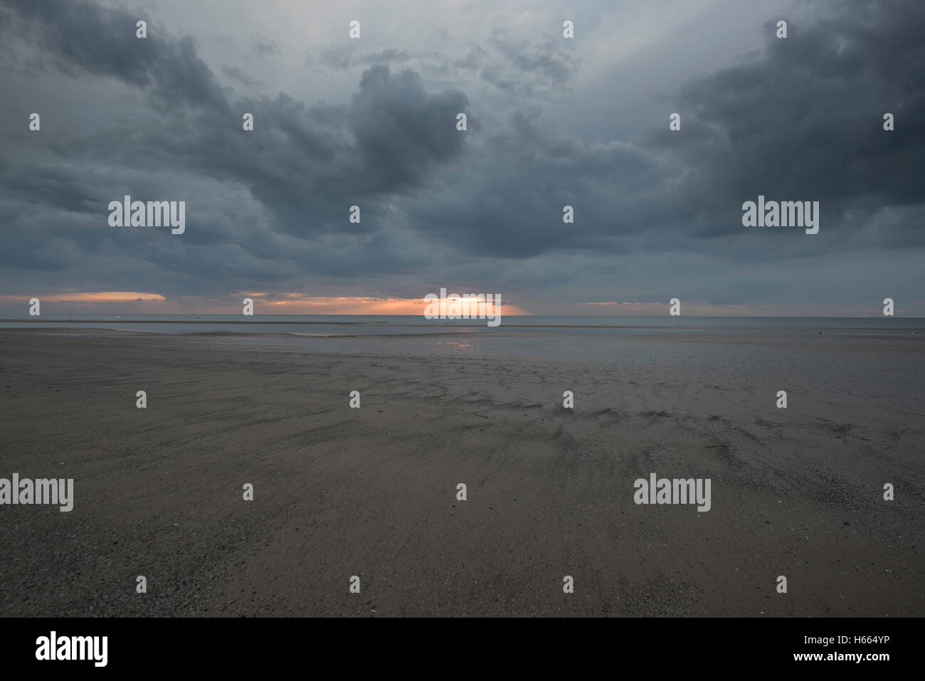 Dark, moody sunset in Blackpool, England during autumn while the famous Black Illuminations are lit up Stock Photo