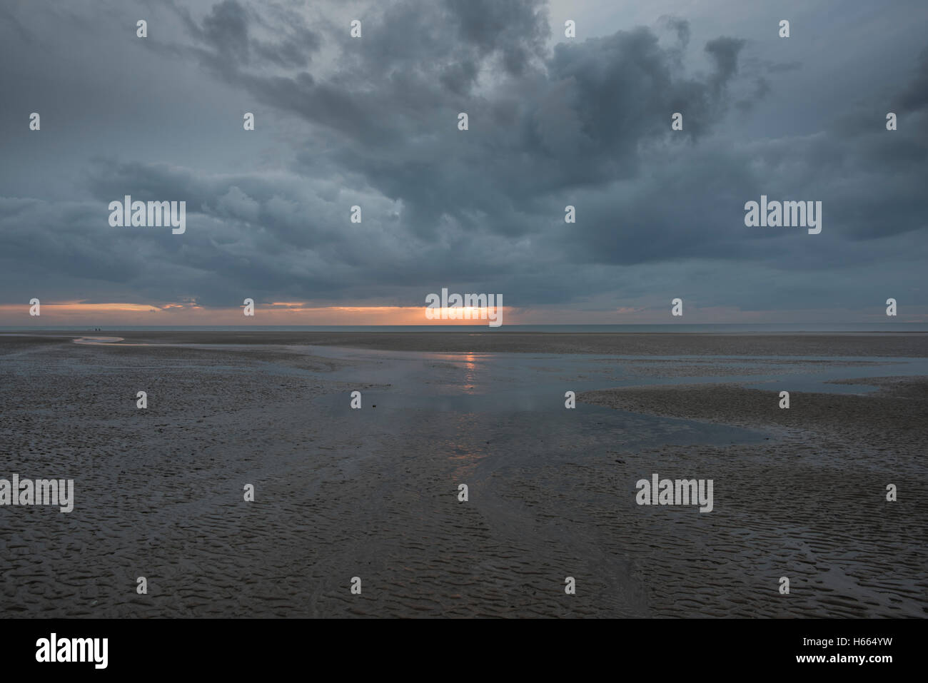 Dark, moody sunset in Blackpool, England during autumn while the famous Black Illuminations are lit up Stock Photo