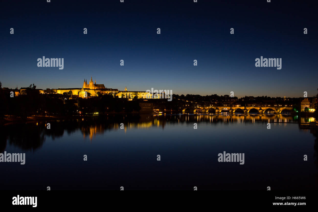 View To Hradschin Castle, St. Vitus Cathedral And Charles Bridge In Prague By Night Stock Photo