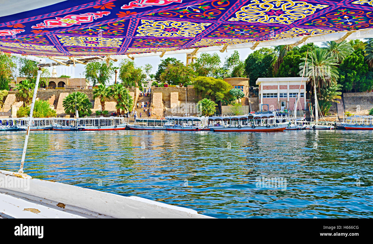 The numerous motor boats wait for the tourists at wharf, Aswan, Egypt. Stock Photo