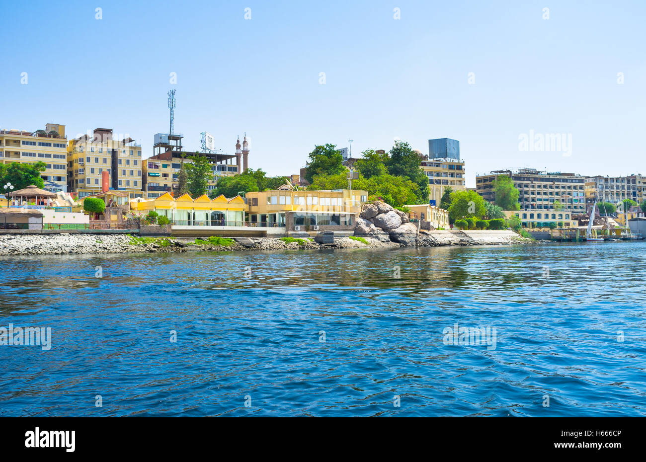 The cityscape of Aswan with the cozy cafes and restaurants on the Kornish al Nile promenade, Egypt. Stock Photo