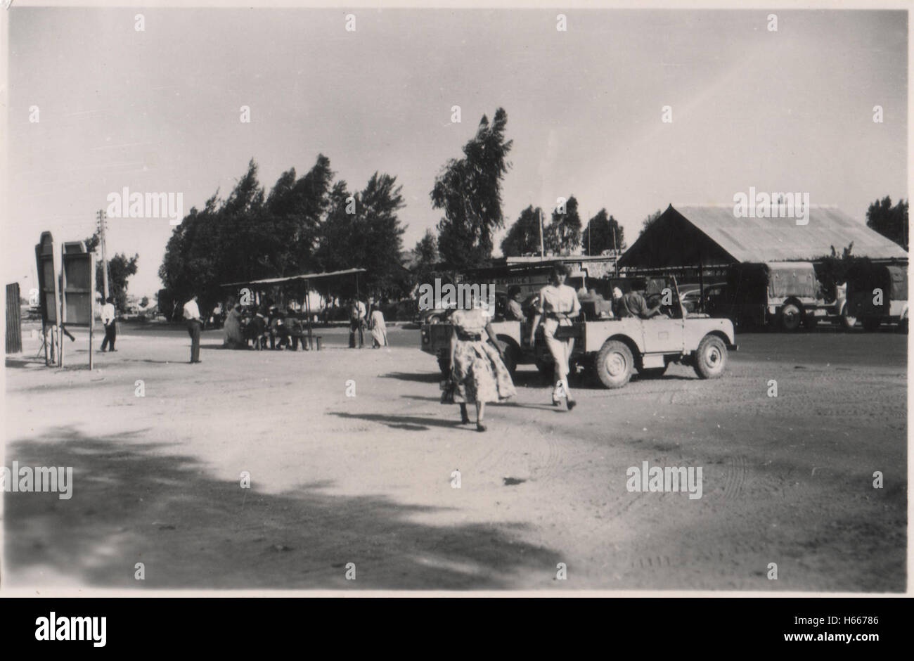 British army personnel landrovers and civilians outside 10 Base Ordnance Depot Royal Army Ordnance Corps (RAOC) camp at Geneifa Ismailia area near the Suez Canal 1952 in the period prior to withdrawal of British troops from the Suez Canal zone and the Suez Crisis Stock Photo