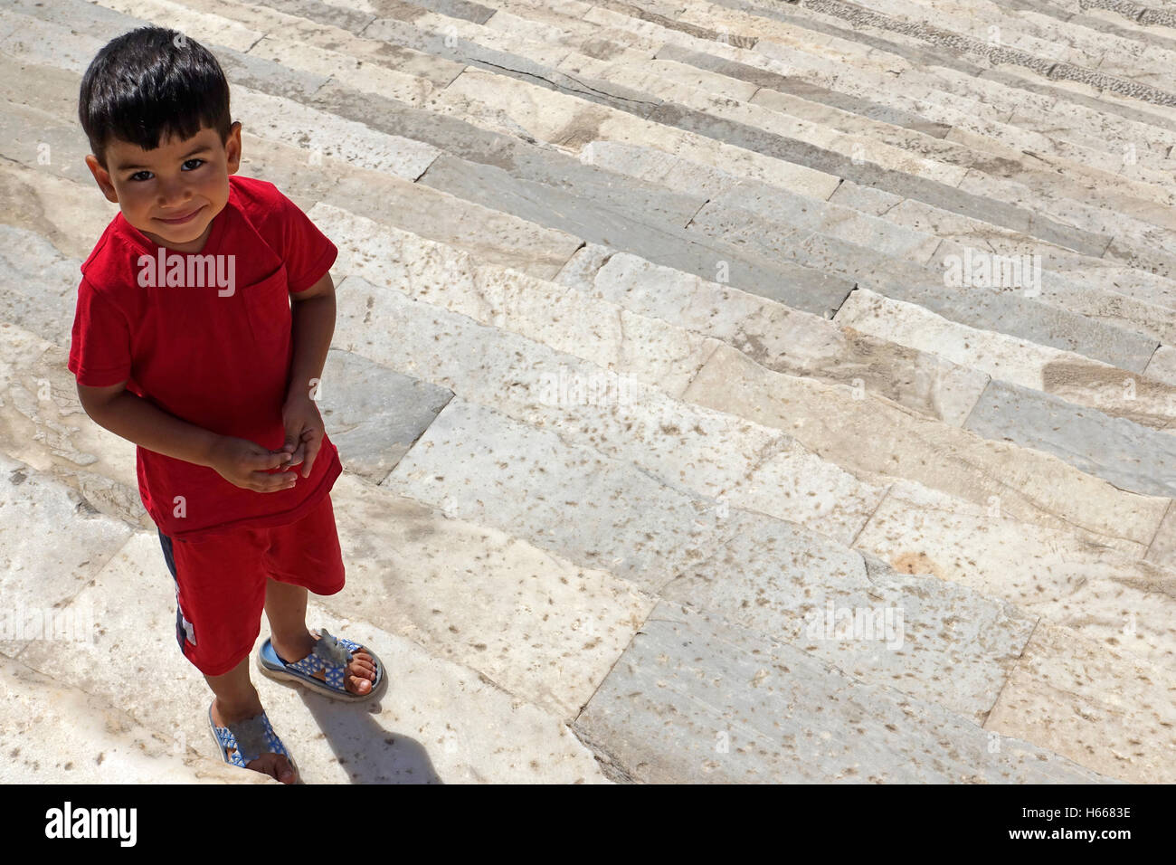 Portrait of smiling boy in the temple of Apollo. Stock Photo