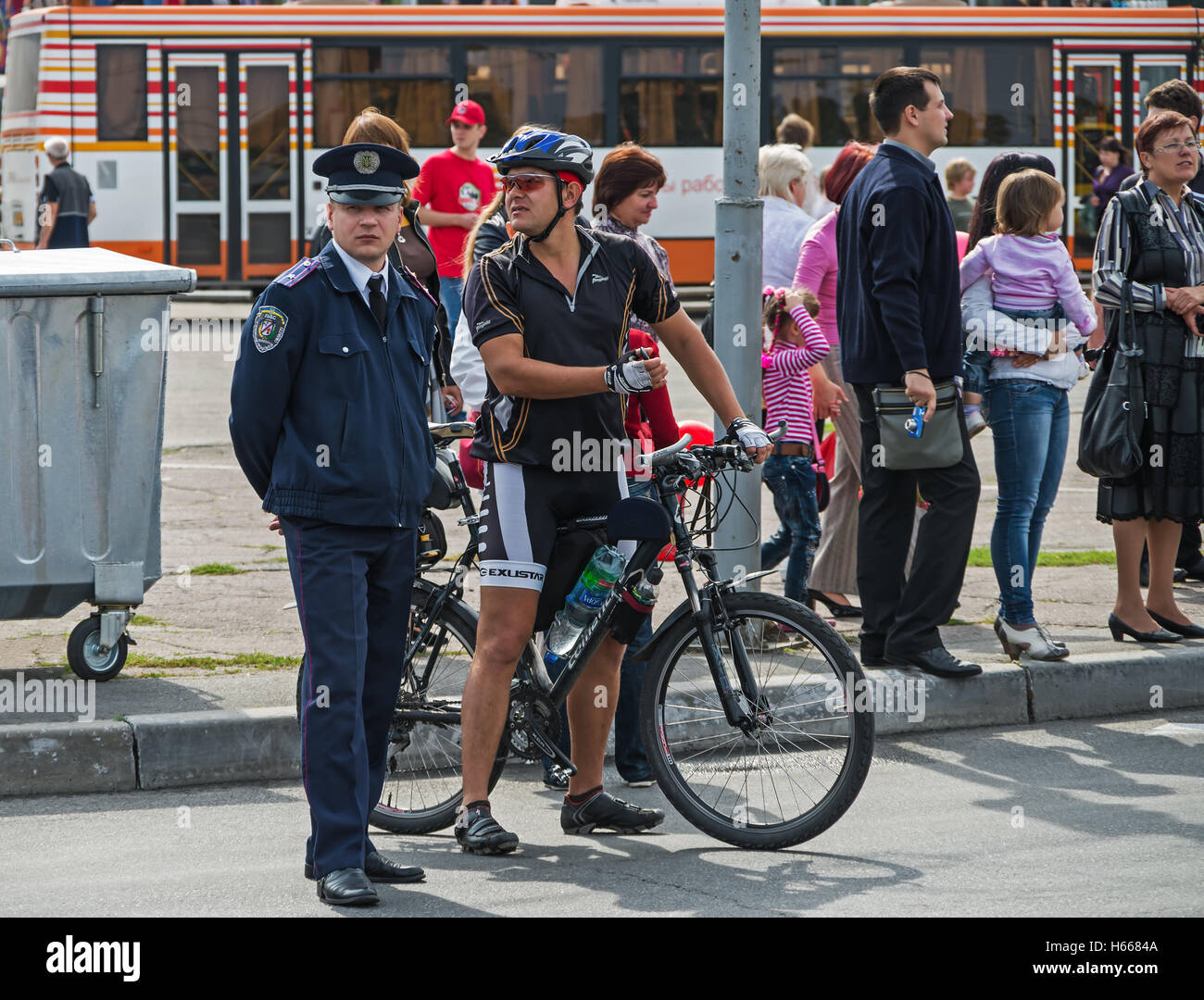 Dnepropetrovsk, Ukraine - September 14, 2013: Police officer and secret agent patrolling the streets in crowded places Stock Photo