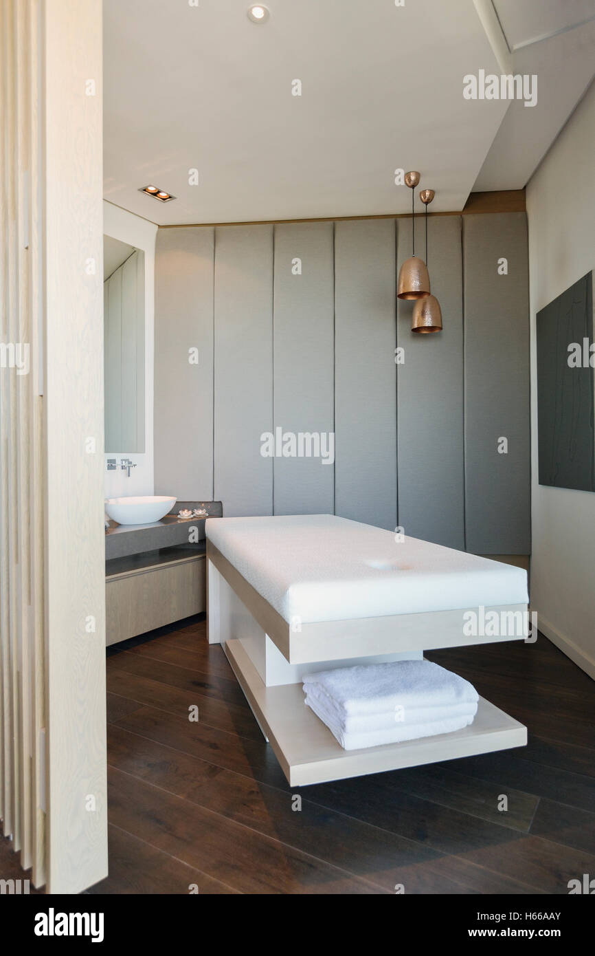 Massage table in modern spa Stock Photo