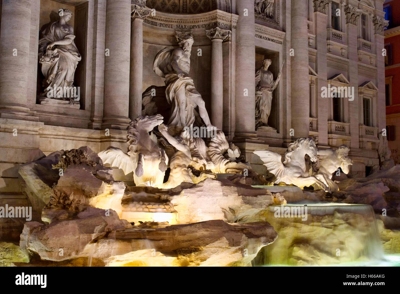 Fontana Di Trevi (Trevi Fountain) at night in Rome. Aqueduct-fed rococo style, designed by Nicola Salvi & completed in 1762, wit Stock Photo