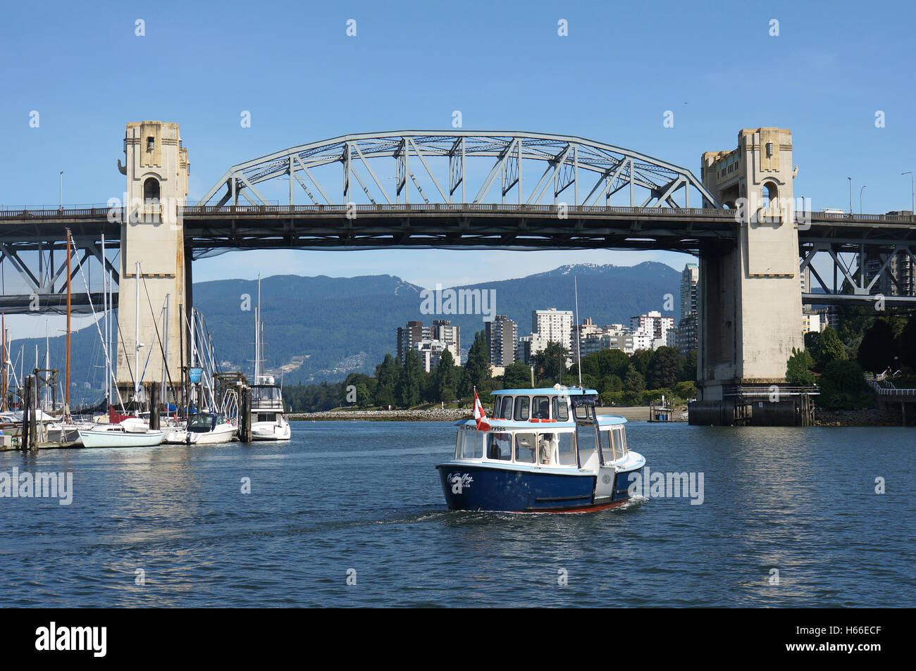 Ferry  crossing False Creek seen from the ferry Dock at Granville Island, Vancouver, Canada Stock Photo