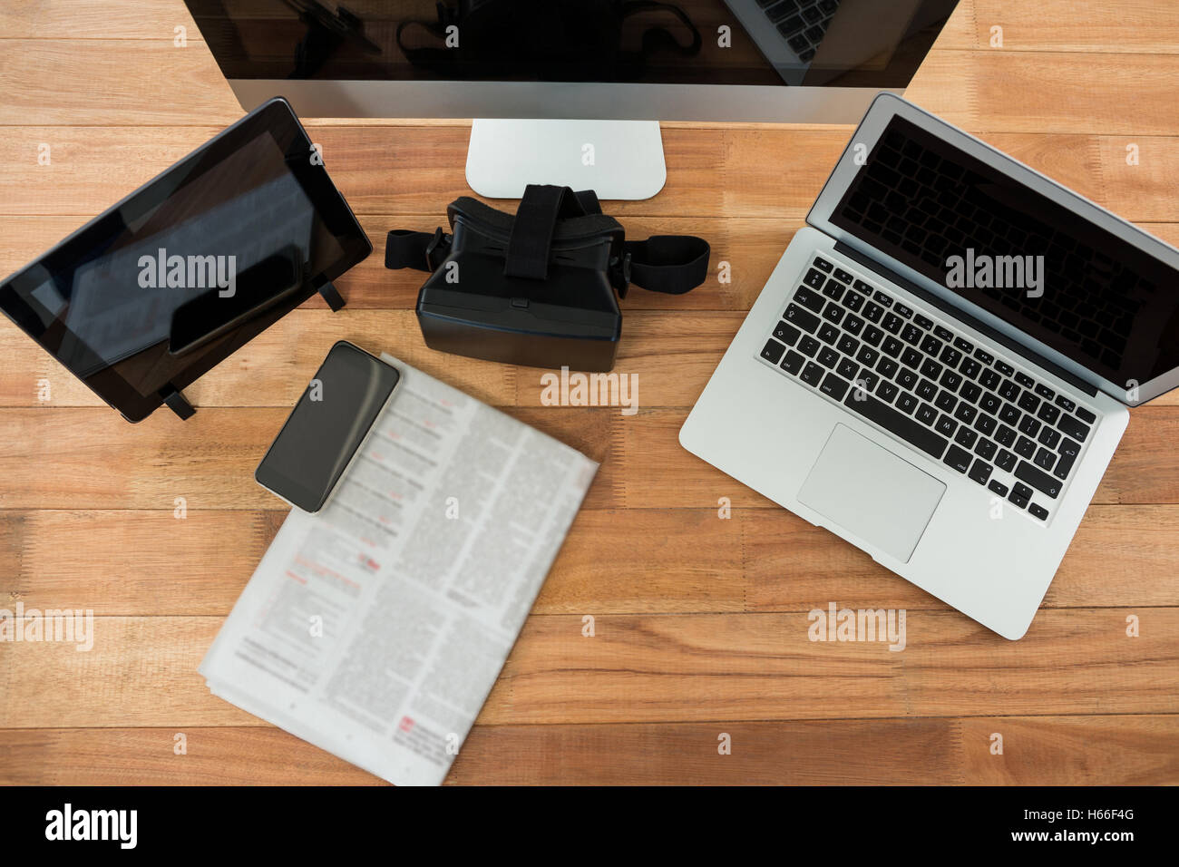Computer, laptop, digital tablet, mobile phone, virtual headset and newspaper Stock Photo
