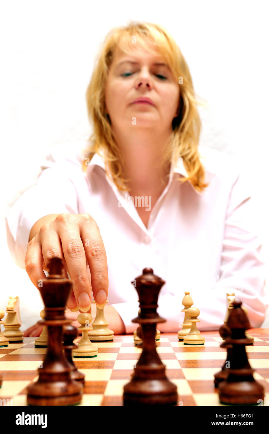 woman making a chess move Stock Photo - Alamy