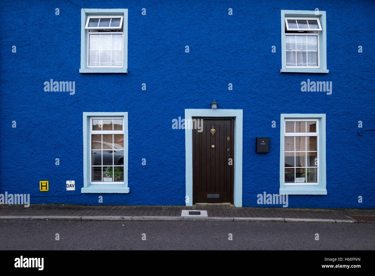 Blue painted pebble dash house in Kinsale, County Cork, Ireland Stock Photo