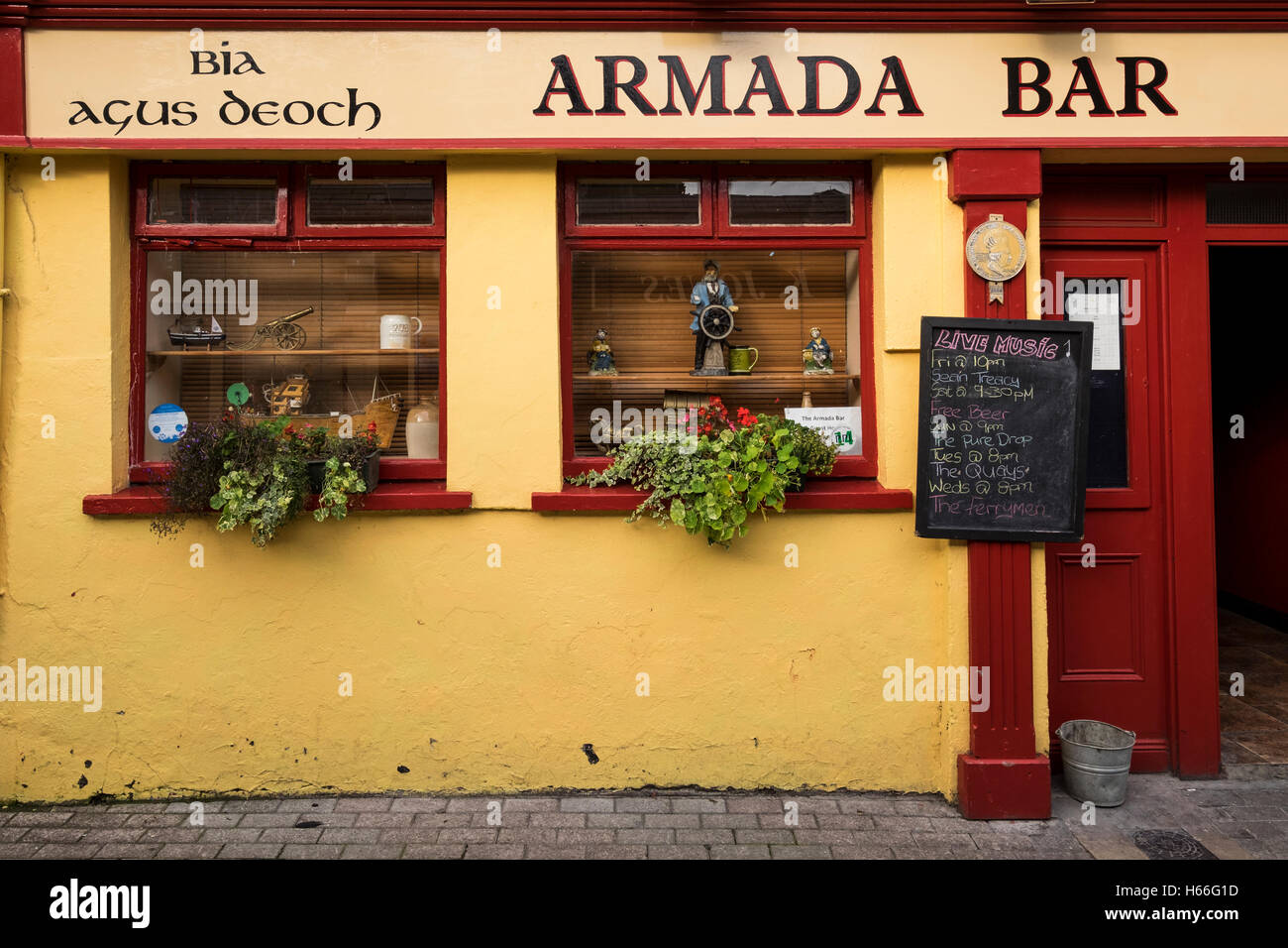 Facade of the Armada bar with signs in Gaelic, irish language, Kinsale, County Cork, Ireland Stock Photo