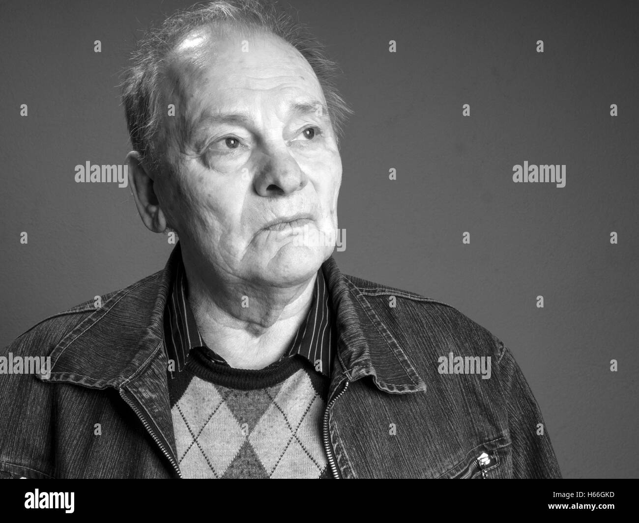 Studio portrait of elderly man Stock Photo Alamy