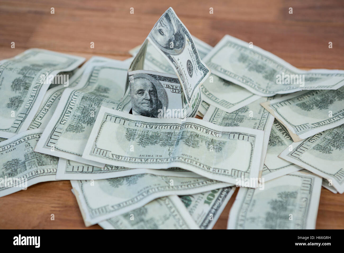 Lots of dollar bank notes scattered on the table Stock Photo
