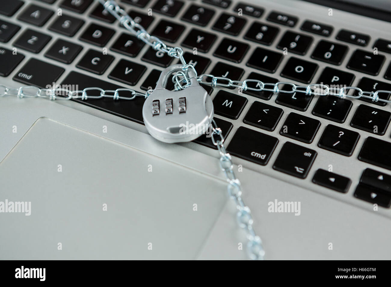 Locked laptop with chain lock Stock Photo