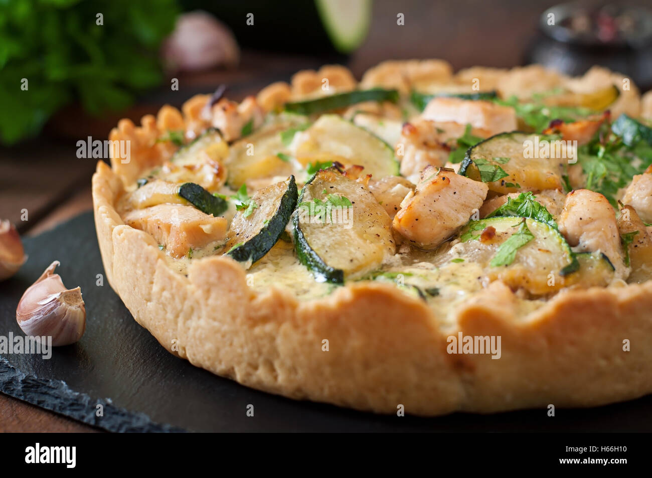 Quiche with chicken and zucchini with herbs Stock Photo