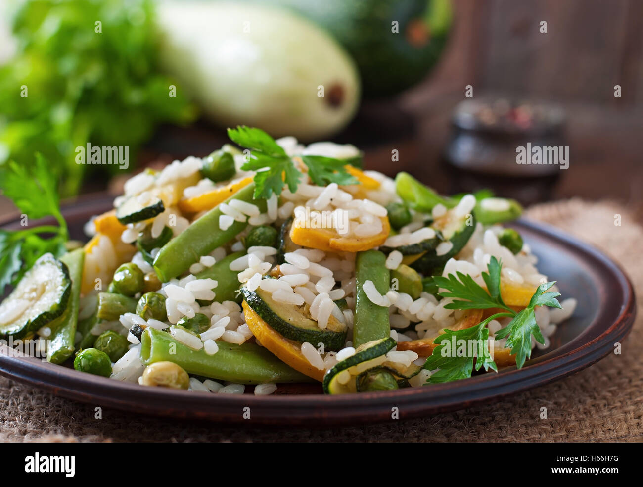Risotto with asparagus beans, zucchini and green peas Stock Photo Alamy