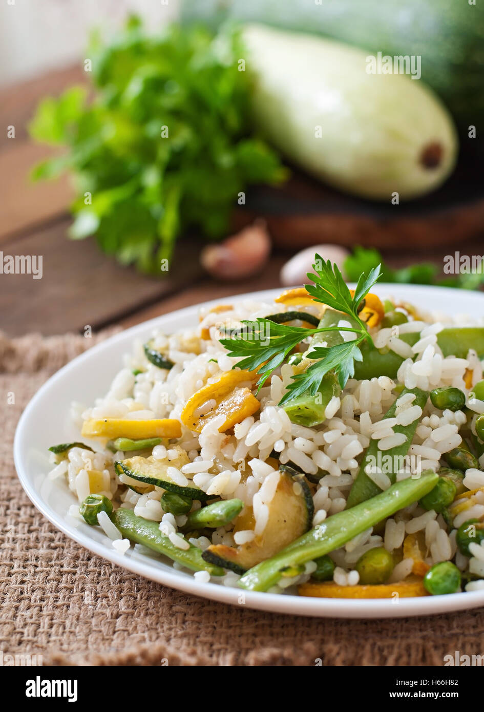 Risotto with asparagus beans, zucchini and green peas Stock Photo Alamy