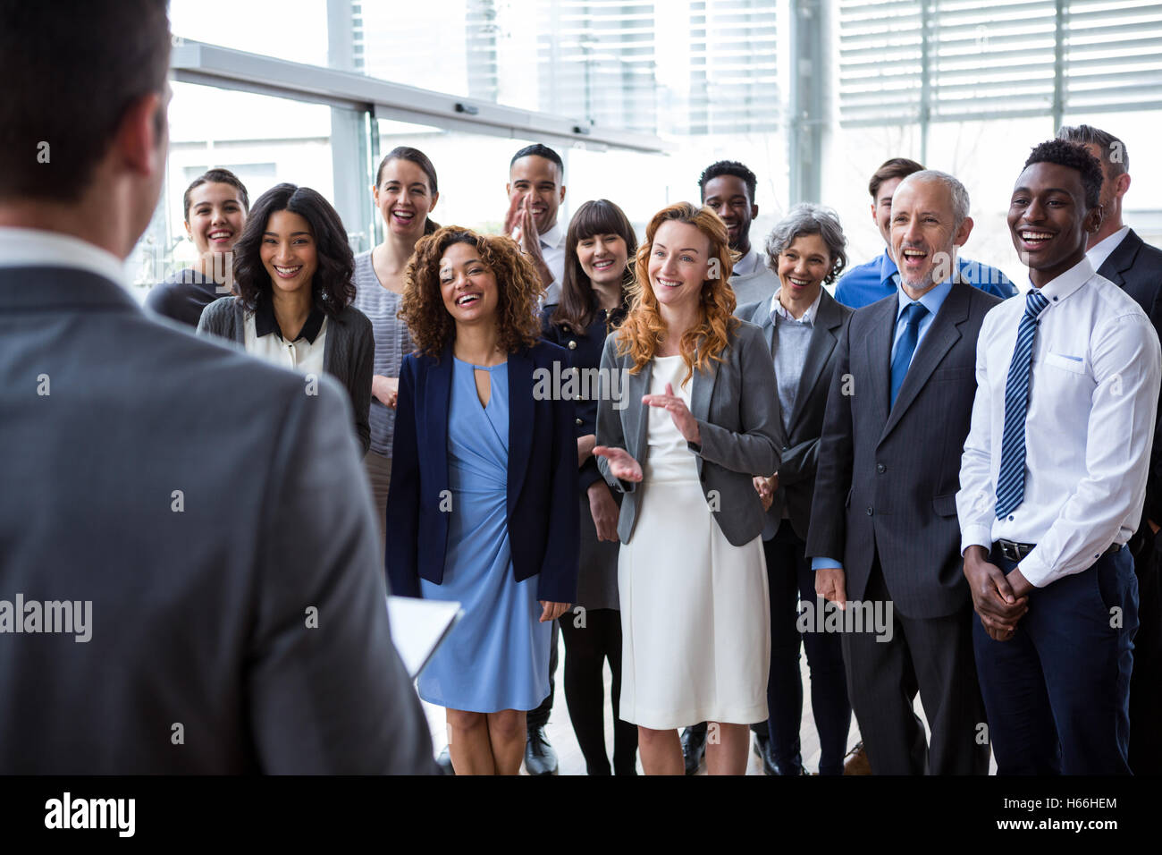 Businessman interacting with colleagues Stock Photo